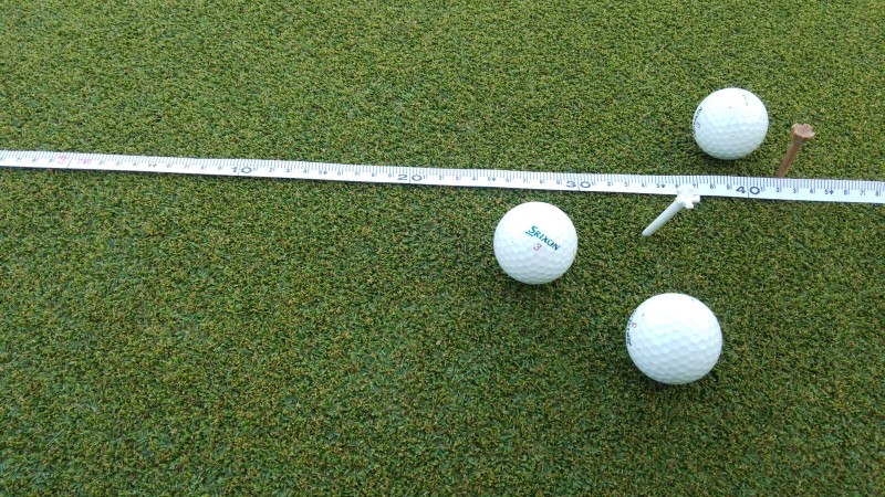 Golf balls and a measuring tape on a korai putting green during the KBC Augusta tournament