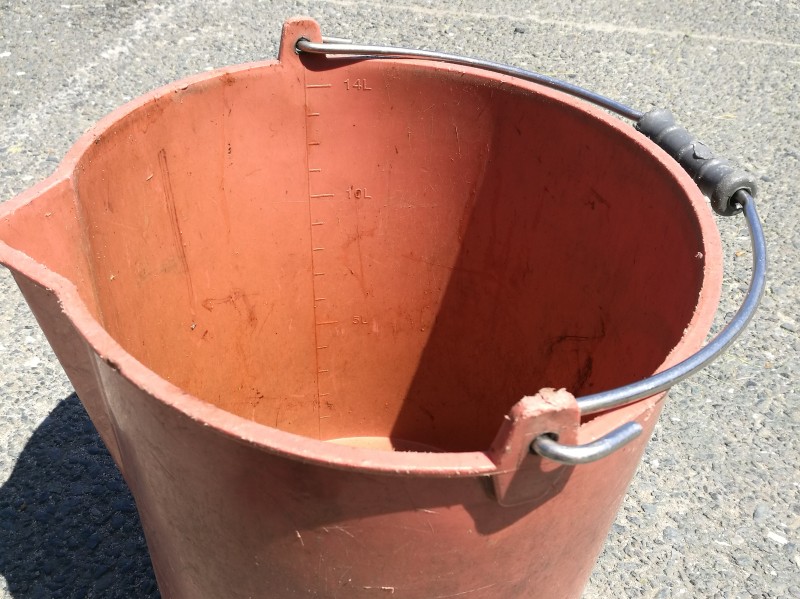 Another graduated bucket used to measure clipping volume from putting greens